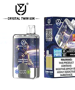 CRYSTAL TWIN 50K disposable vape device and packaging featuring an astronaut design, promoting 50,000 puffs, double flavor (strawberry raspberry cherry and Mr Blue), and a nicotine addiction warning.