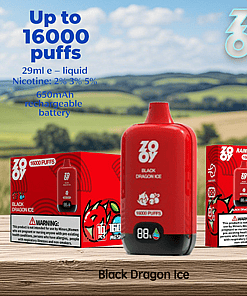 Red Zooy Black Dragon Ice vape device and packaging with product details such as up to 16,000 puffs, 29ml e-liquid, various nicotine strengths, and a 650mAh rechargeable battery, displayed outdoors on a wooden surface with a grassy landscape in the background.