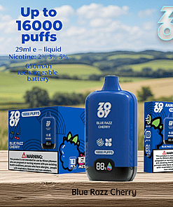 Blue Razz Cherry disposable vape device and packaging with product details, including up to 16,000 puffs, 29ml e-liquid, multiple nicotine strengths, and a 650mAh rechargeable battery, displayed on a wooden surface with a scenic countryside background.