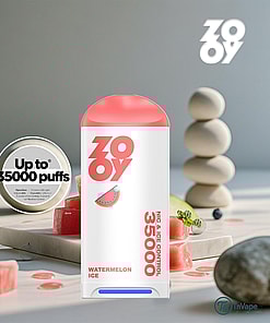 Colorful ZOOVY Watermelon Ice disposable vape device with a pink cap, marked for up to 35,000 puffs, surrounded by watermelon pieces, smooth stones, and stacked pebbles in a modern setting.