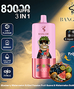 Promotional image for the BANG DE 3-in-1 vape device with 8000 puffs, featuring a pink and metallic device, e-liquid display, and icons for battery capacity, volume, and charging type; includes a cartoon monkey on the device and a bowl of fruits and bubble gum illustrating flavors: blueberry watermelon, kiwi passion fruit guava, and watermelon bubble gum.