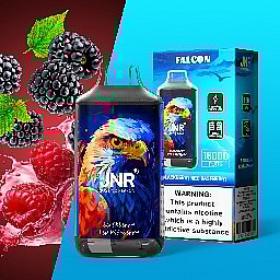 Vape product packaging featuring an illustrated falcon, with blackberries and raspberries in the background and a nicotine warning label on the box.