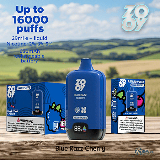 Blue Razz Cherry disposable vape device and packaging with product details, including up to 16,000 puffs, 29ml e-liquid, multiple nicotine strengths, and a 650mAh rechargeable battery, displayed on a wooden surface with a scenic countryside background.